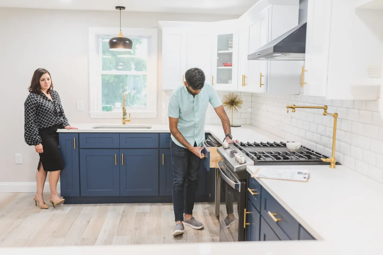Kitchen with blue lower cabinets and white upper cabinets